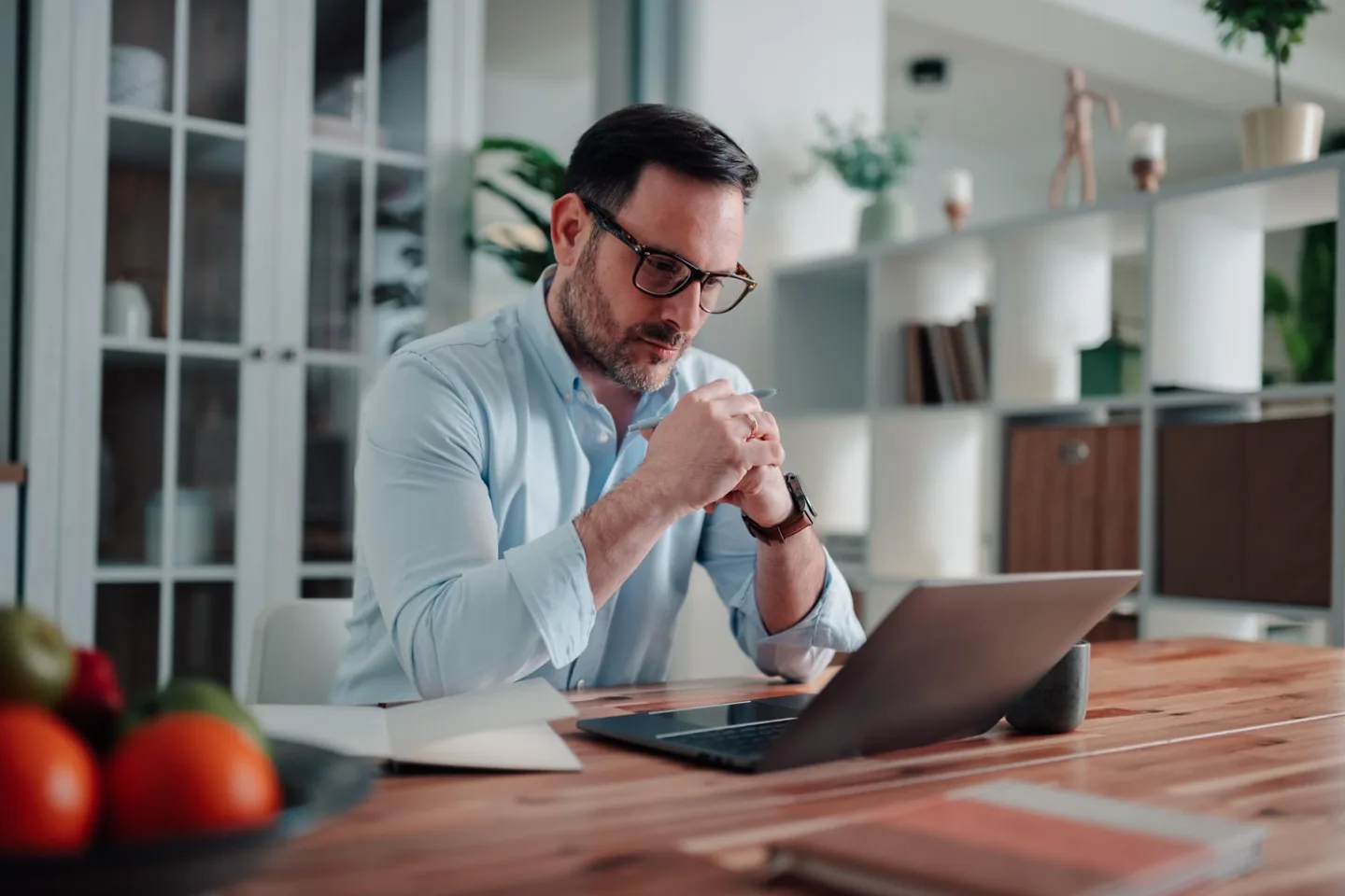 Adult reviewing information on a laptop as part of a cognitive wellness routine